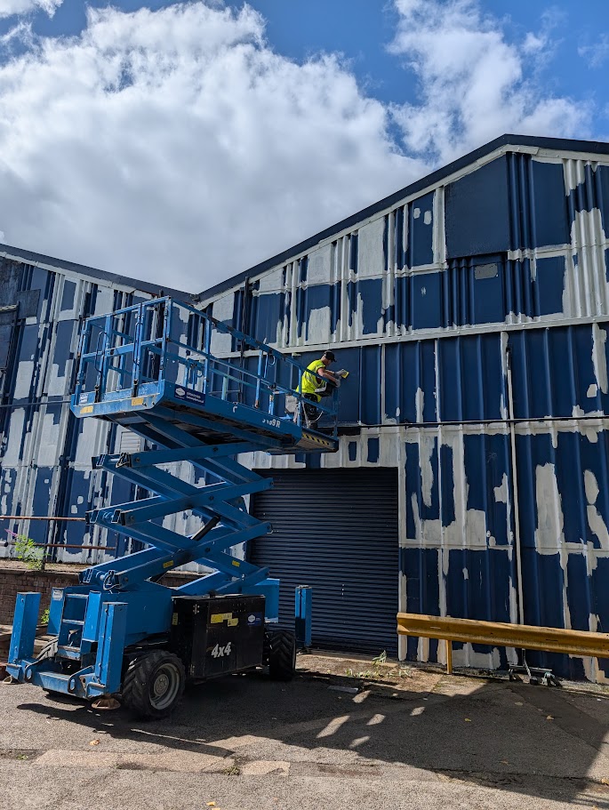 Applying encapsulation coating to a surface as part of asbestos management