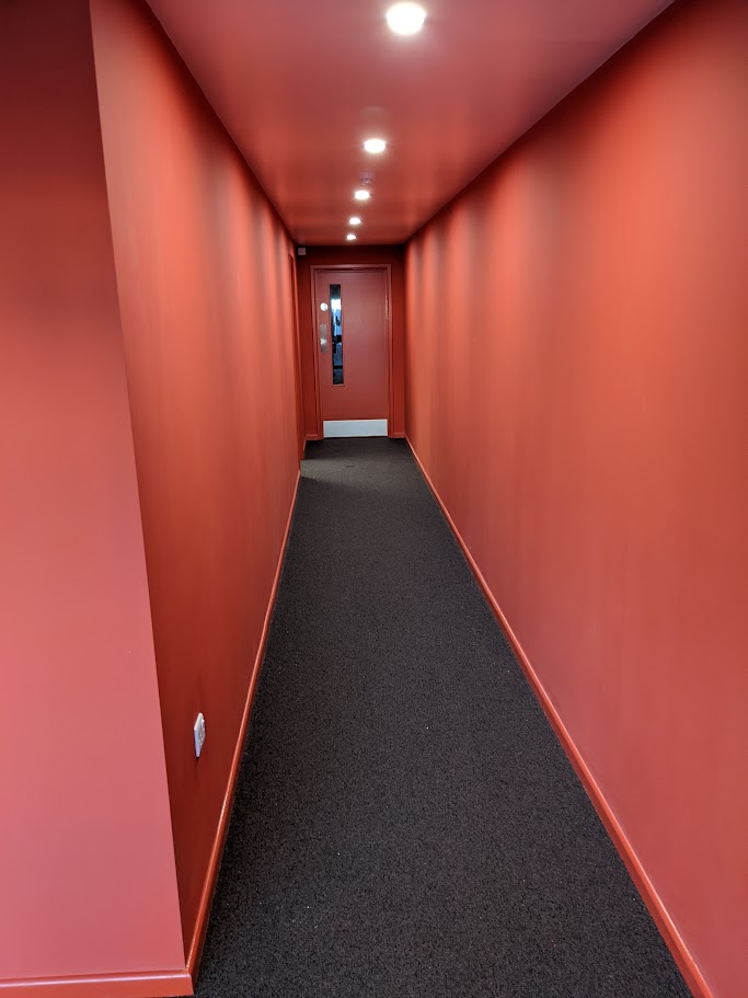 Replacing worn carpet tiles in a commercial corridor