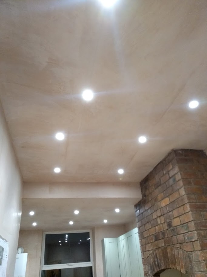 Plastering and repairing a ceiling in a commercial building