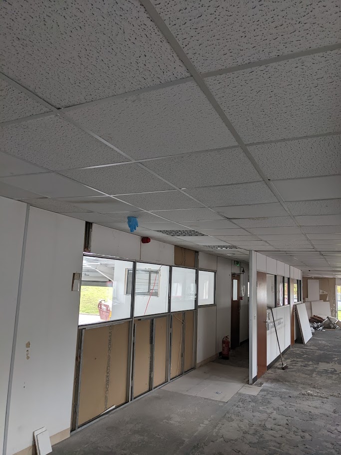 Replacing ceiling tiles as part of a planned maintenance visit