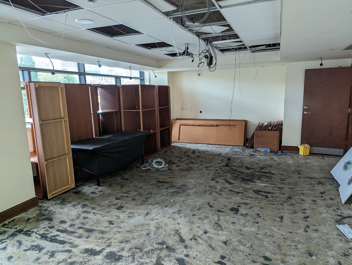 Contractors removing internal fixtures and fittings during a dilapidations project