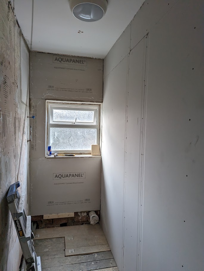 Completed drylining installation with plasterboard walls prepared for taping and finishing