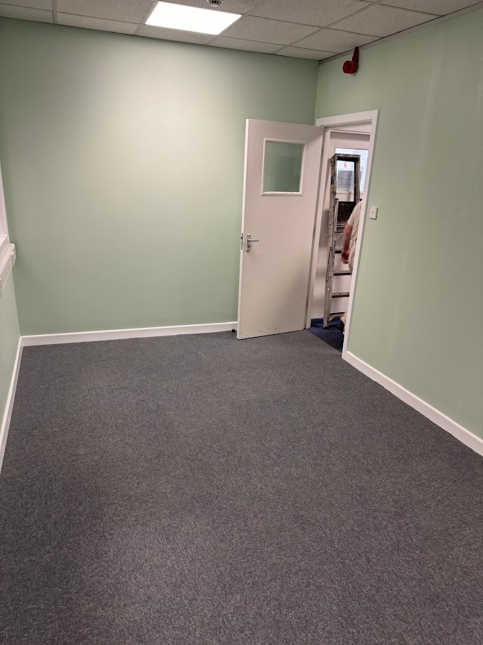 Commercial flooring installation taking place during an interior refurbishment project