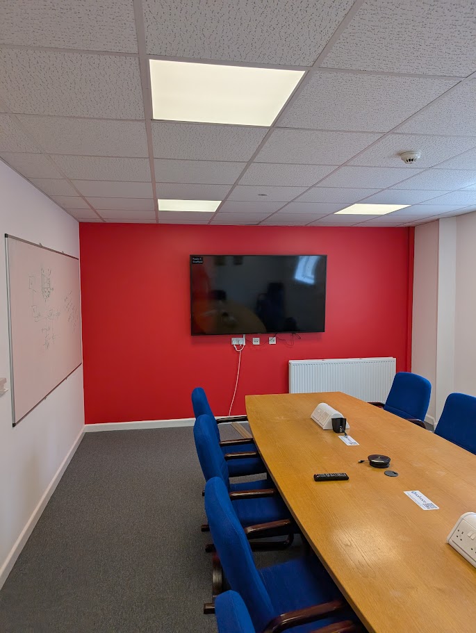 Commercial decorators completing finishing works inside an office refurbishment