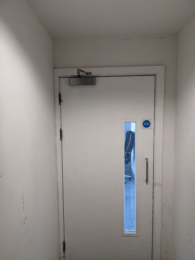Fire door ironmongery and door closer fitted for compliance