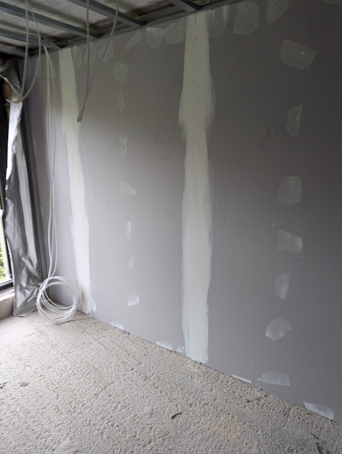 Plasterboard installation during commercial drylining works