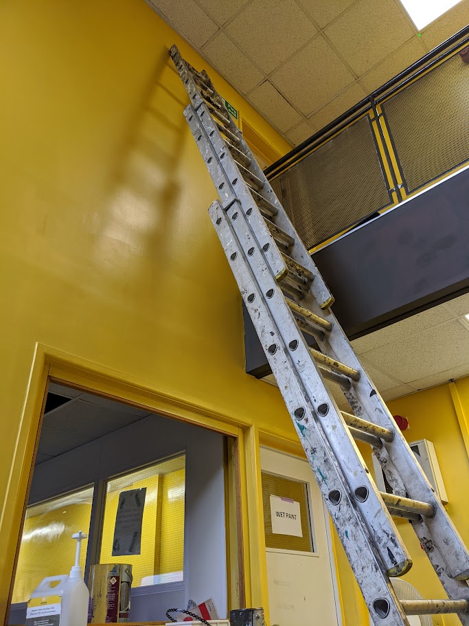 Painting and decorating school corridors during holiday works