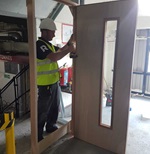 Fire door installation contractor fitting commercial fire door