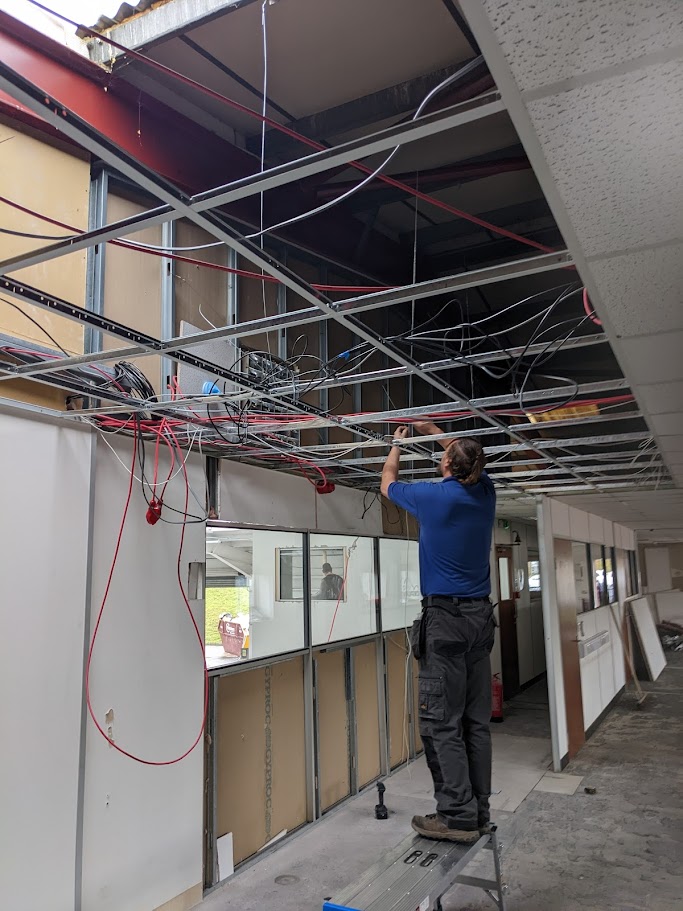 Installing a suspended ceiling grid in a commercial room in Sheffield