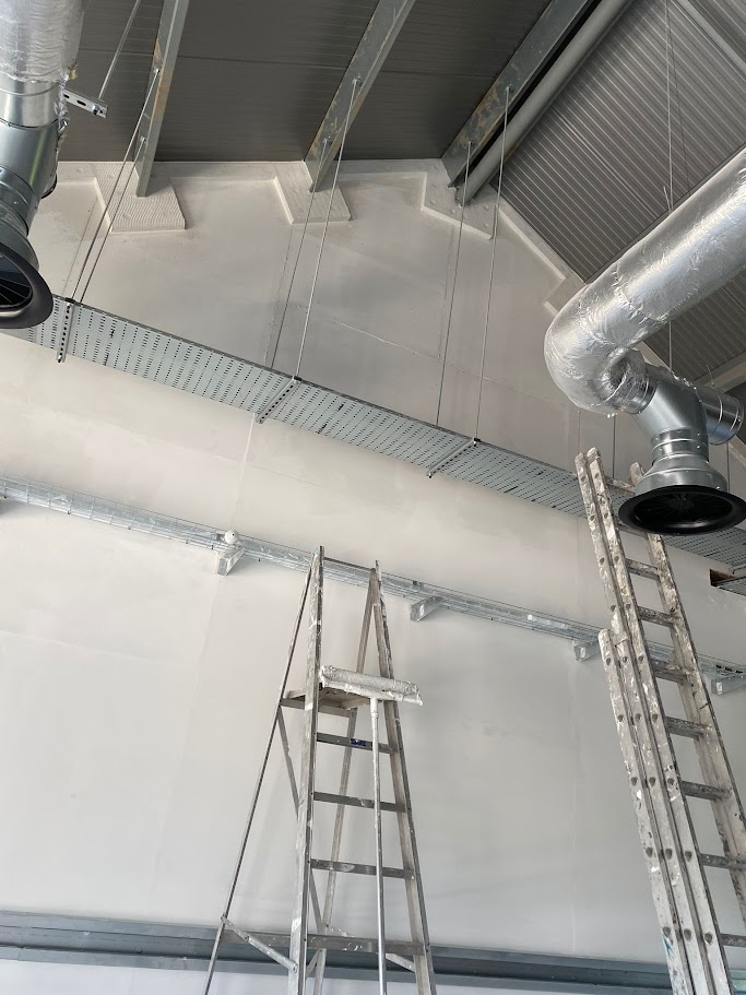 Applying durable coatings to warehouse walls and surfaces in South Yorkshire