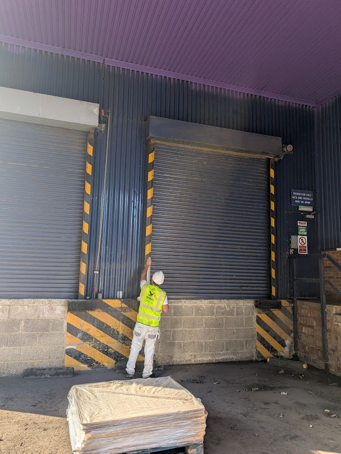 Warehouse loading bay door and shutter system