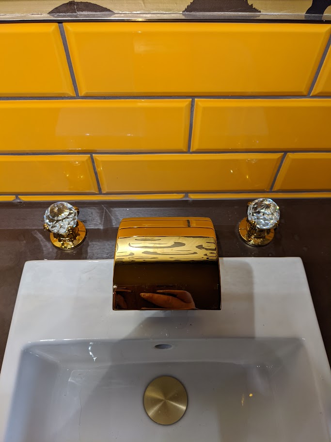 Final decorating and finishing touches in a refurbished commercial washroom